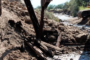 Jon Johnson Photo/Gila Valley Central: Water eroded the eastern cliff side of the Matthewsville Wash and washed out the train bridge. 