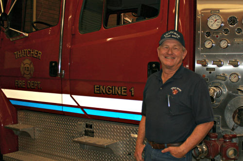 Brooke Curley Photo/ Gila Valley Central: Thatcher Fire Chief Mike Payne stands beside one of the fire trucks in the Thatcher fire station. 