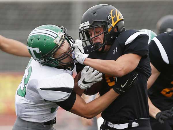 Photo By Michael Chow: Thatcher's Dallin Cook tackles Round Valley's Braden Brown. 