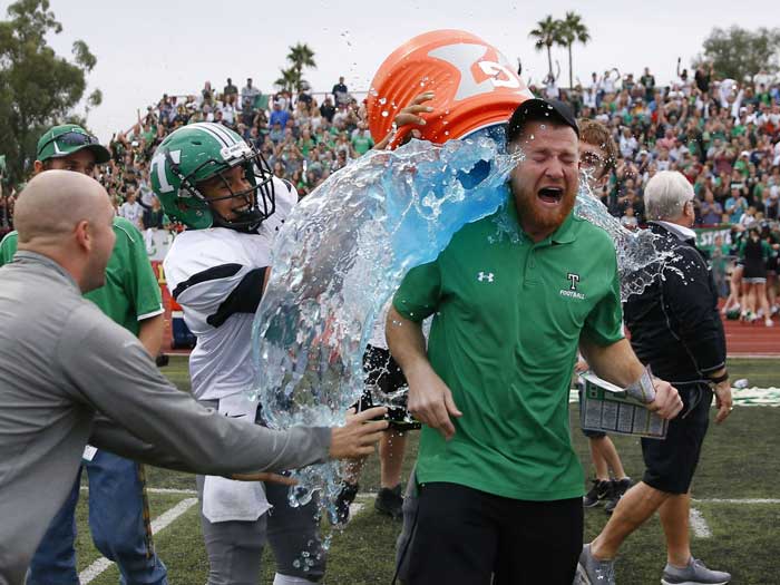 Photo By Michael Chow: Thatcher head coach Sean Hinton receives a Gatorade shower after the victory.