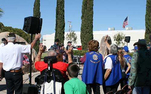 Brooke Curley Photo/ Gila Valley Central: As Tribute sang, "God Bless the USA" the crowd stood up, holding hands and singing along. 