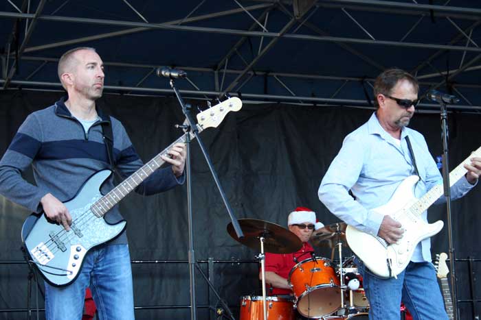 Photo By Walter Mares: Clifton Town Manager Ian McGaughey, right, jams on the bass.