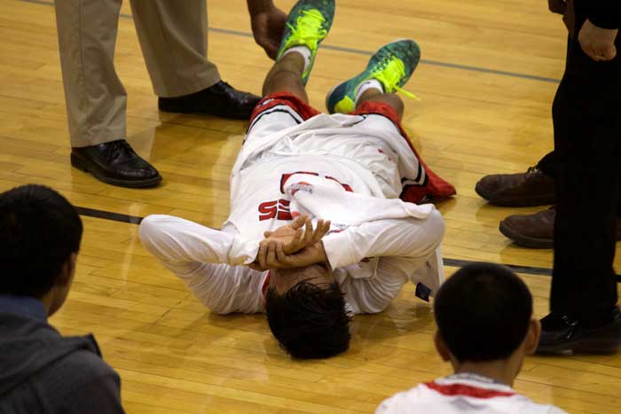 Jon Johnson Photo/Gila Valley Central: San Carlos' Michael Antonio writhes in pain after injuring his knee. 