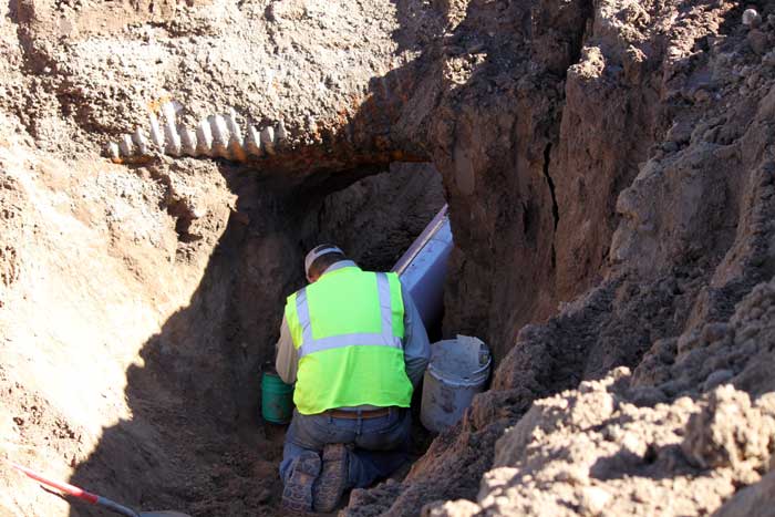 Jon Johnson Photo/Gila Valley Central: A Safford Utilities employee works on the reclaimed water pipeline. 