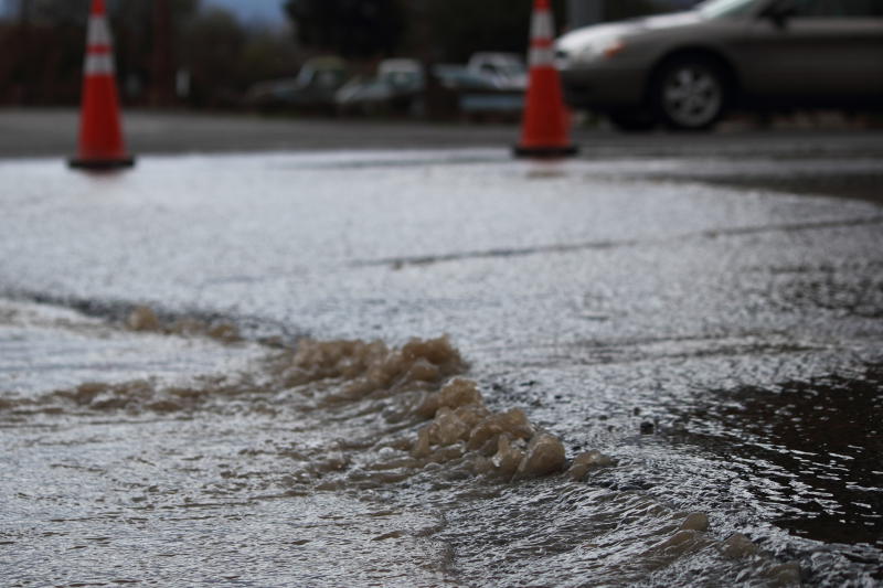 Eric Burk Photo/Gila Valley Central: Water seeps up through the asphalt on First Avenue in Thatcher.
